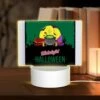 Rectangular Acrylic Night Light, A Poster With A Witches Hat And A Cauldron With A Green Background.