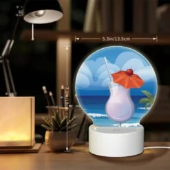 Round Acrylic Night Light, A Cocktail With A Cherry On Top Is Sitting On A Beach. 7 Round Acrylic Night Light, A Cocktail With A Cherry On Top Is Sitting On A Beach. -Pattern Night Light 12d9b6d29d524a168e2ecf90f9329677239fccb2