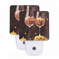 Night Light Set Of 2, Two Wine Glasses Filled With Candy And A Pumpkin.