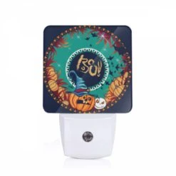 Night Light, A Round Design With A Pumpkin And A Wizard's Hat On It.