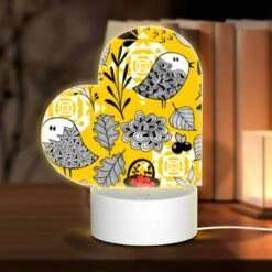 Love Acrylic Night Light, A Yellow And Black Patterned Fabric With A Bird And A Basket Of Berries.