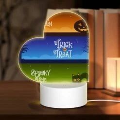 Love Acrylic Night Light, A Colorful Halloween Banner With The Words "Happy Halloween" And "Trick Or Treat" Written On It.