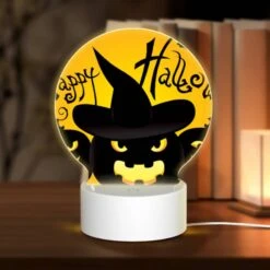Round Acrylic Night Light, Three Black And Yellow Pumpkins Are Shown With A Witch's Hat On Top Of Each One.