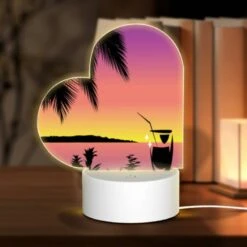 Love Acrylic Night Light, A Cocktail Glass Is Sitting On A Table In Front Of A Beautiful Sunset.