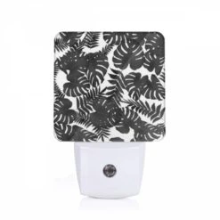 Night Light, A Black And White Photo Of A Leafy Plant.