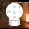 Round Acrylic Night Light, Six Different Types Of Plants Are Shown In A Row. 2 Round Acrylic Night Light, Six Different Types Of Plants Are Shown In A Row. -Pattern Night Light 65aa26afc16cd77b7c2e418f7adcb83b847b5043