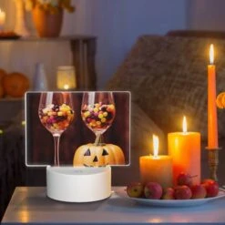 Rectangular Acrylic Night Light, A Pumpkin Is Sitting Next To Two Wine Glasses Filled With Candy. 8 Rectangular Acrylic Night Light, A Pumpkin Is Sitting Next To Two Wine Glasses Filled With Candy. -Pattern Night Light 6a8a45347fa64432c6c44eee1ecd97bc6f2cd75e