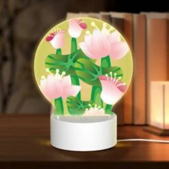 Round Acrylic Night Light, A Painting Of A Flower With A Green Stem.