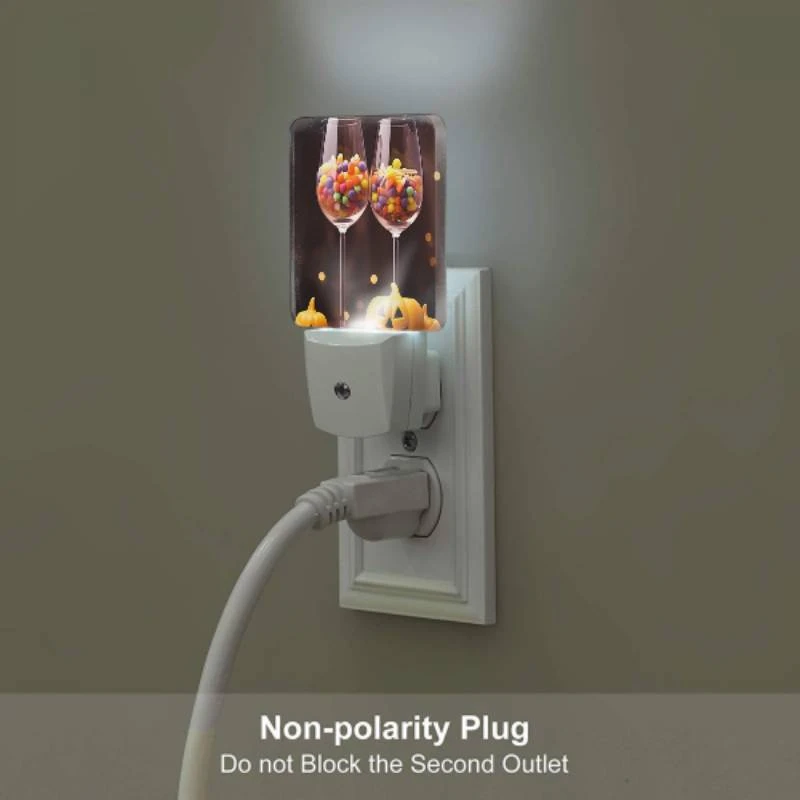 Night Light Set of 2, Two wine glasses filled with candy and a pumpkin. Night Light Set Of 2, Two Wine Glasses Filled With Candy And A Pumpkin. -Pattern Night Light 8e3fc4eba65b88314103d8f77dcb6ddffb598119