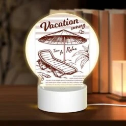 Round Acrylic Night Light, A Beach Umbrella Is Open And Shading A Lounge Chair.