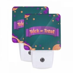 Night Light Set Of 2, A Purple And Orange Banner With The Words "trick Or Treat" On It.