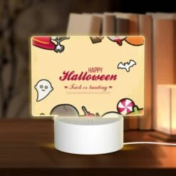 Rectangular Acrylic Night Light, A Colorful Halloween Poster With Various Halloween Items.