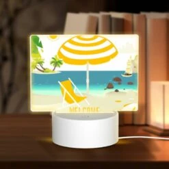 Rectangular Acrylic Night Light, A Yellow And White Umbrella Is Set Up On A Beach