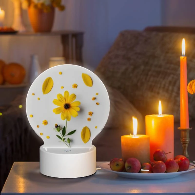 Round Acrylic Night Light, A yellow flower with yellow petals and green leaves is placed on a white surface. Round Acrylic Night Light, A Yellow Flower With Yellow Petals And Green Leaves Is Placed On A White Surface. -Pattern Night Light dd607f462c2f90870393f6c5f76050a1bf5d2575
