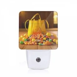Night Light, A Yellow Bag With A Smiley Face On It Is Filled With Candy.