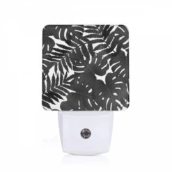 Night Light, A Close Up Of A Leafy Plant With A Black And White Background.