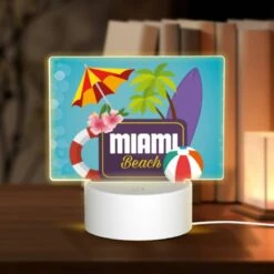 Rectangular Acrylic Night Light, A Logo For Miami Beach With A Surfboard And Beach Umbrella.