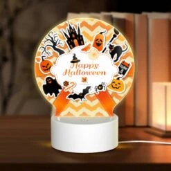 Round Acrylic Night Light, A Colorful Sticker With A Witch On It And The Words "Happy Halloween" On It.